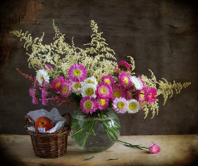 Still life with pink flowers and peach