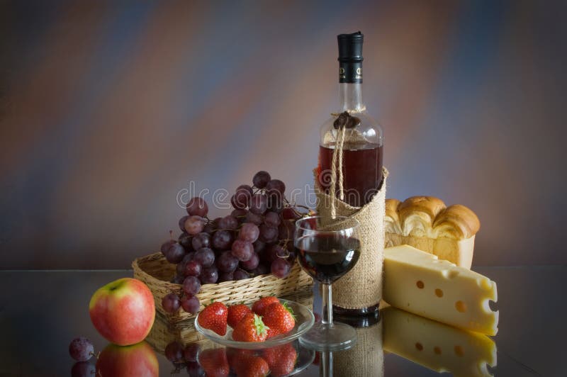 Still life with red wine, cheese and fruit