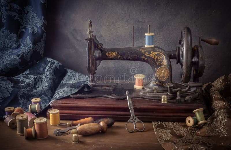 Still life with a sewing machine, scissors, threads royalty free stock photo Still life with a sewing machine, scissors, threads royalty free stock photo