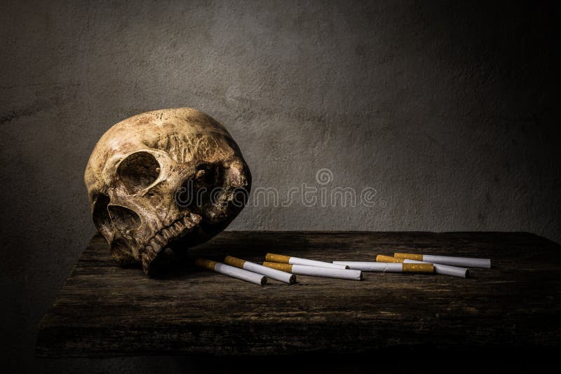Still life skull and cigarette people smoke cigarette and get to stock photos Still life skull and cigarette people smoke cigarette and get to stock photos