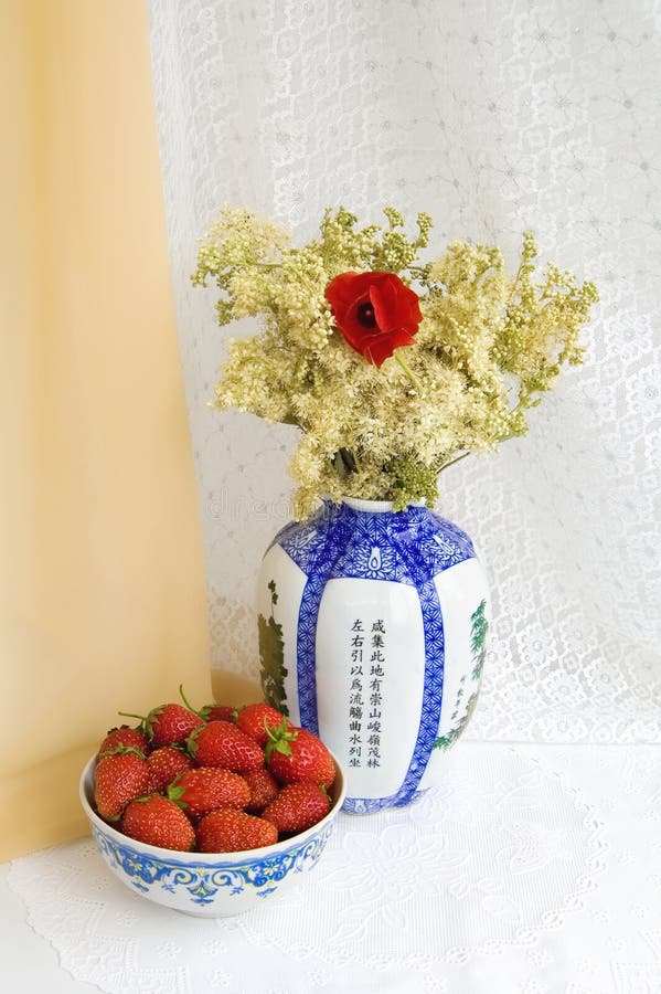 Still life with strawberries and flowers