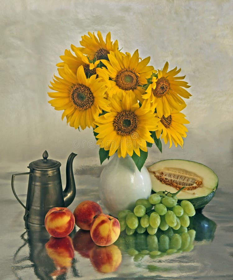 Still life with a sunflowers and fruits stock image Still life with a sunflowers and fruits stock image