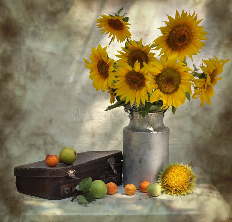 still life with sunflowers and old suitcase