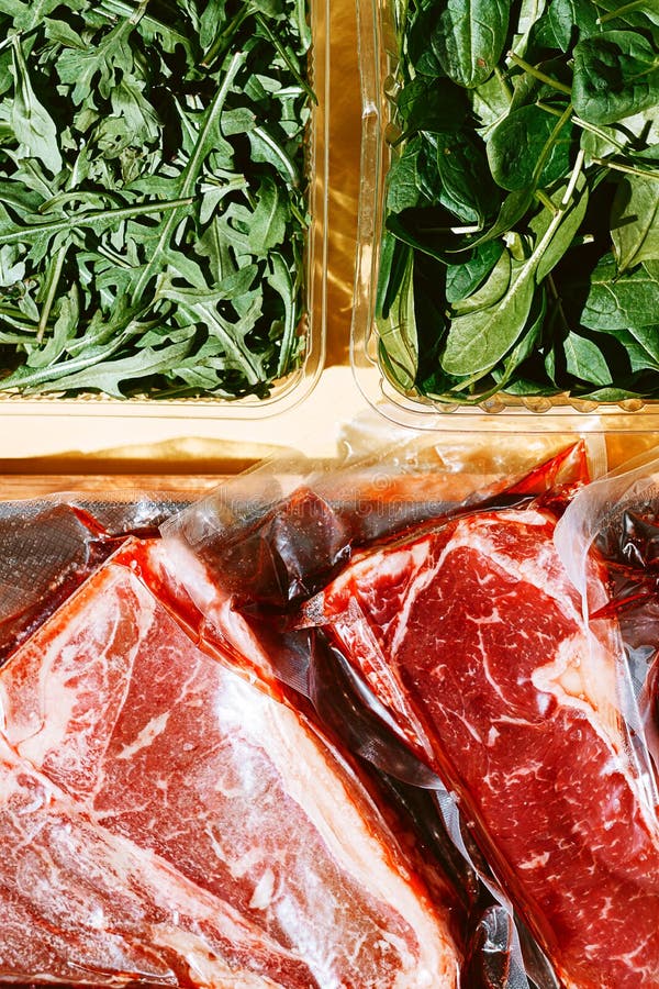 Still Life of Vacuumpacked Meat with Herbs and Butcher`s Tools Stock