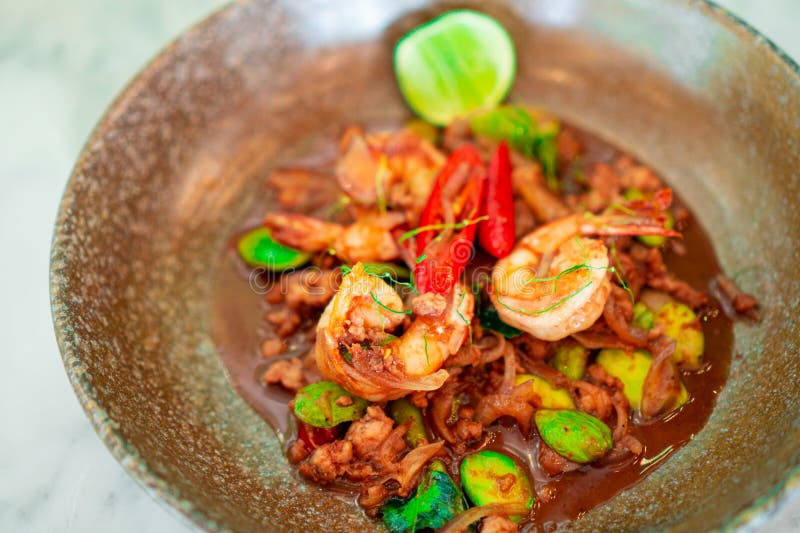 StirFried Bitter Bean with Shrimp Paste and Minced Pork Stock Photo