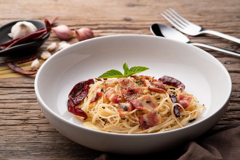 StirFried Capellini Pasta with Dried Chili and Crispy Bacon on White Plate Stock Image Image