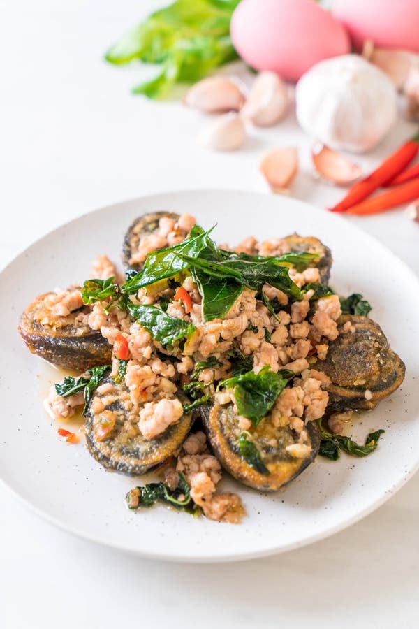 Stirfried Century Egg and Minced Pork with Holy Basil Leaves Stock