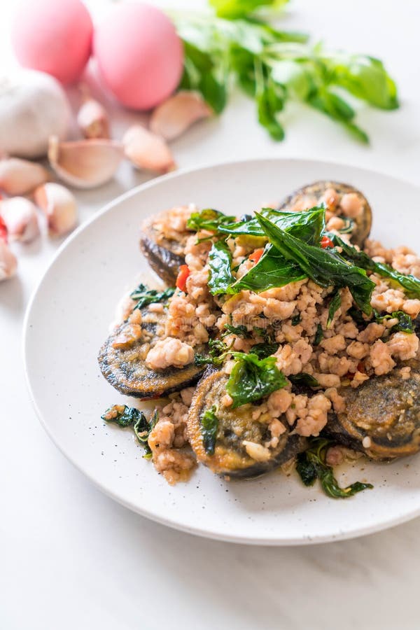 Stirfried Century Egg and Minced Pork with Holy Basil Leaves Stock