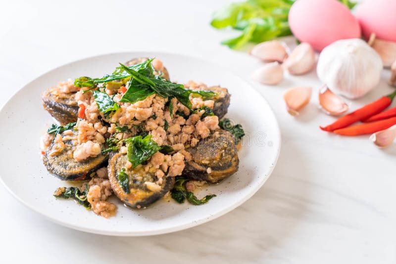 Stirfried Century Egg and Minced Pork with Holy Basil Leaves Stock