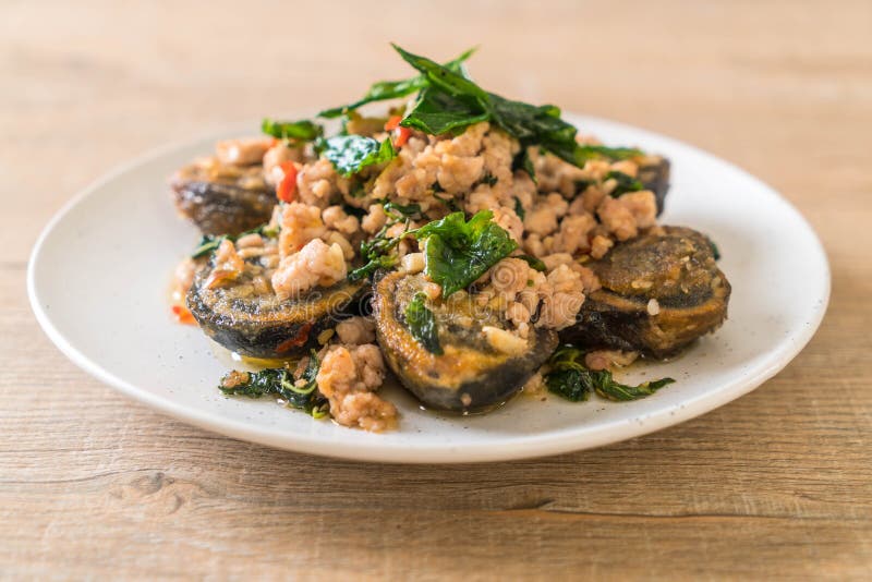 Stirfried Century Egg and Minced Pork with Holy Basil Leaves Stock