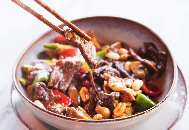 Stirfried Chinese Dish with Diced Beef, Vegetables, and Peanuts Cooked