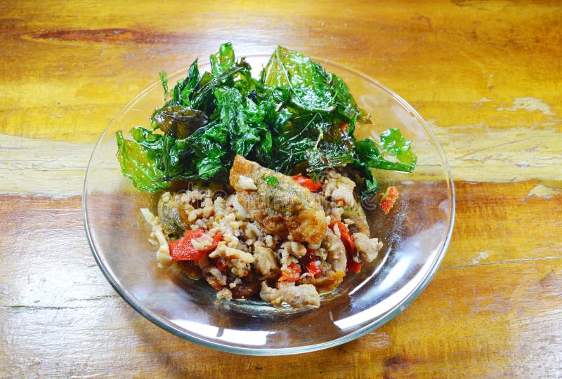 Stir Fried Crispy Basil Leaf with Black Preserved Egg and Minced Pork