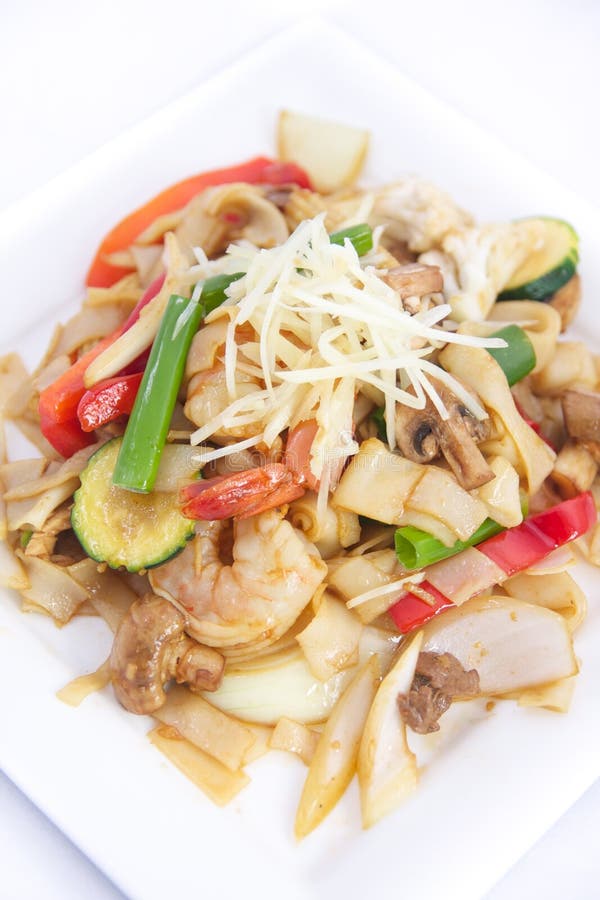 Stir fried flat rice noodles with ginger sauce.