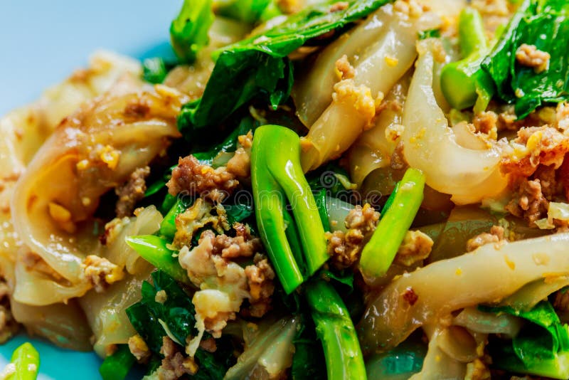 Stir Fried Instant Noodle with Pork and Chinese Kale. Stock Image