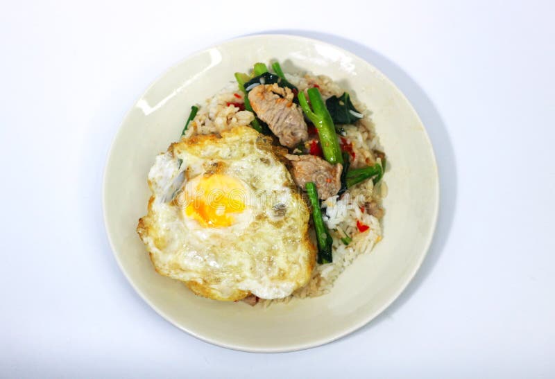 Stir Fried Kale with Rice and Fried Eggs on White Background, Thai Food