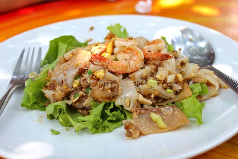 Stir-fried rice noodle with soy sauce. stock photos Stir-fried rice noodle with soy sauce. stock photos