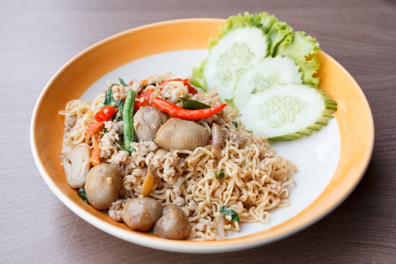 Stir fried spicy noodle with pork and straw mushroom stock photo Stir fried spicy noodle with pork and straw mushroom stock photo