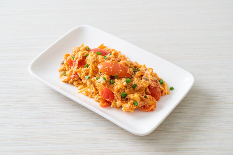 Stirfried Tomatoes with Egg or Scrambled Eggs with Tomatoes Stock