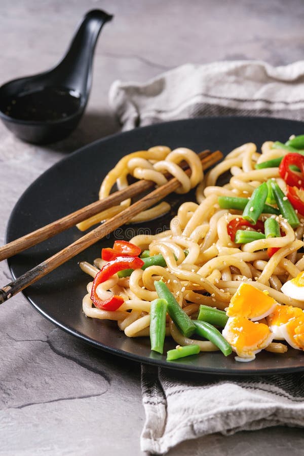 Stir fry udon noodles stock photo. Image of chopsticks - 93224448