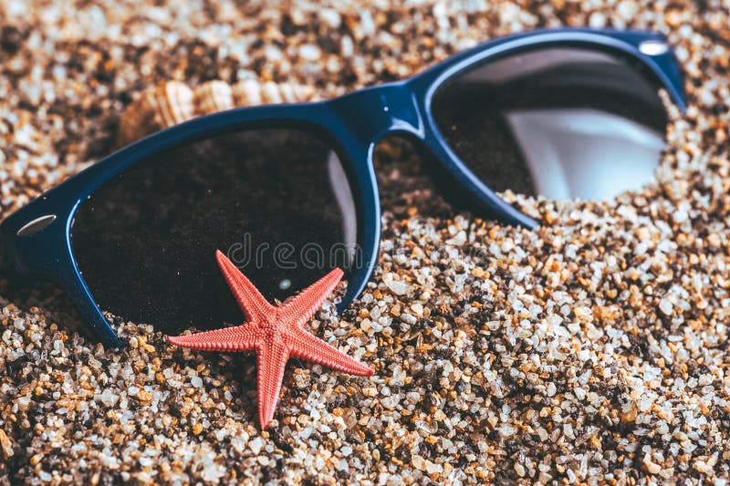 Starfish and Sunglasses on the Beach, Summer Vacation Concept. Starfish and Sunglasses on the Beach, Summer Vacation Concept