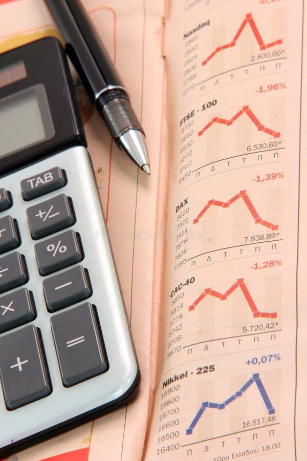 Stock charts on newspaper stock photo. Image of calculator 3859420