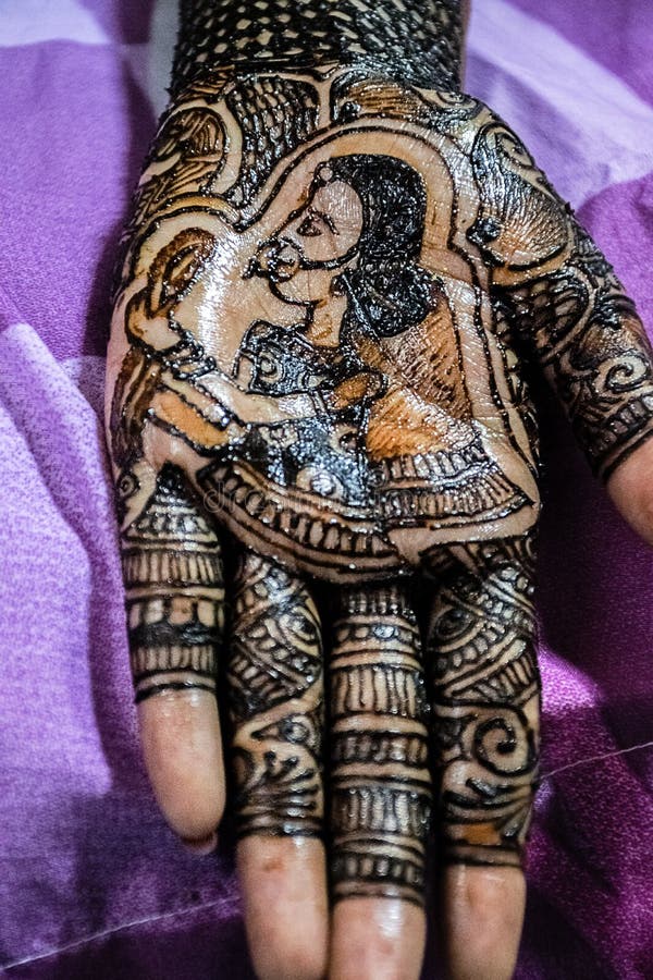 Stock Photo of Indian Bride Hand Beautifully Decorated by Henna Tattoo or Henna  Design or Mehndi Design for Wedding at Kolhapur Stock Photo - Image of  ethnicity, colors: 215296652