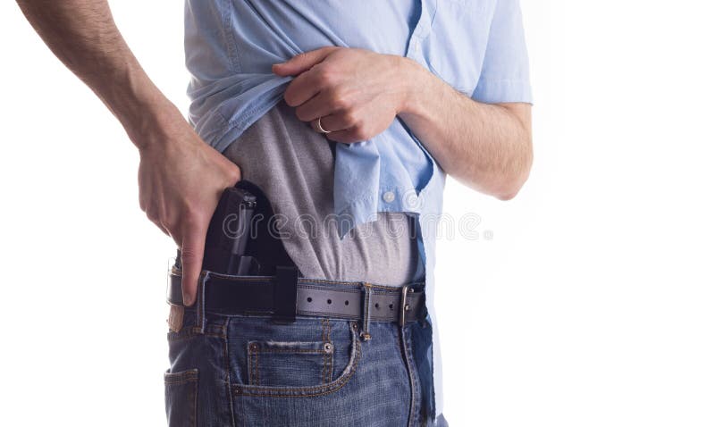 Man drawing concealed carry pistol