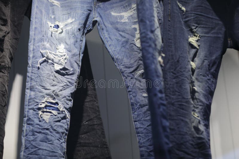 Torn Denim Jeans on Display at a Mall Store Stock Image - Image of worn ...