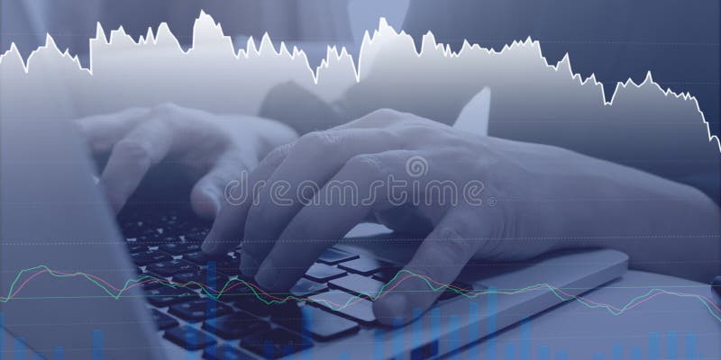 Stock trader trading by Analyzing stock graph chart stock photo.