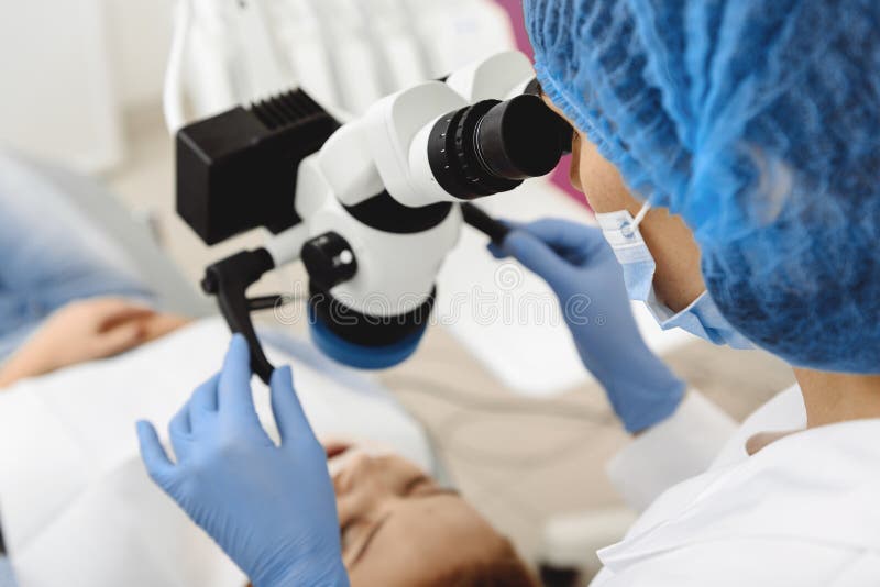 Stomatologist examining client with dental tool