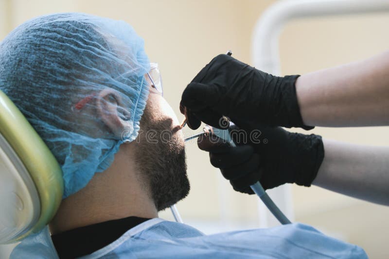Stomatology - male patient at dentidtry clinic stock photography Stomatology - male patient at dentidtry clinic stock photography