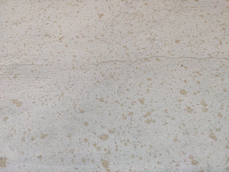 Stone background with small spots of paint. Stone texture with scratches and surface irregularities stock image