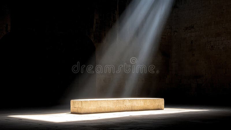 The image depicts a large, rectangular stone bench positioned in the center of a dimly lit room. The bench is illuminated by a beam of light that shines down from the top right corner, casting a bright glow on the bench and illuminating the surrounding area. The room features a stone wall on the right side, and the floor is made of stone tiles. The overall scene is dark, with the light source providing the primary illumination. Large rectangular light source stock images, royalty-free photos and pictures
