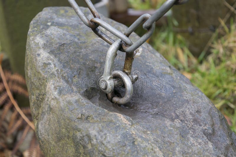Stone with a Chain Attached to it