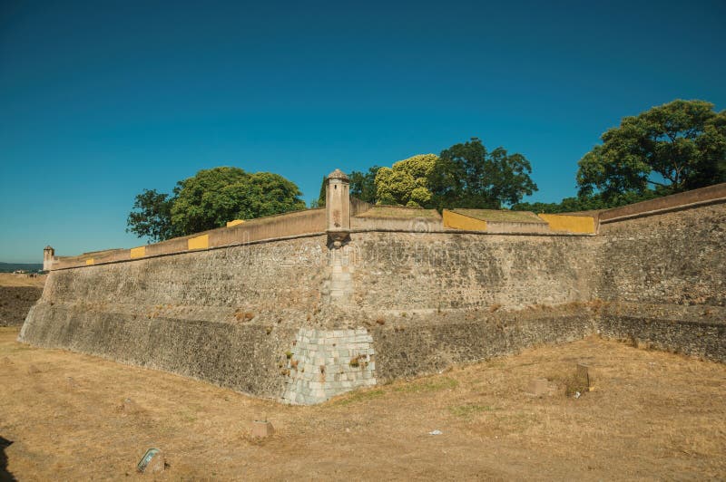 Stone city wall corner with watchtower and dry moat stock photos Stone city wall corner with watchtower and dry moat stock photos
