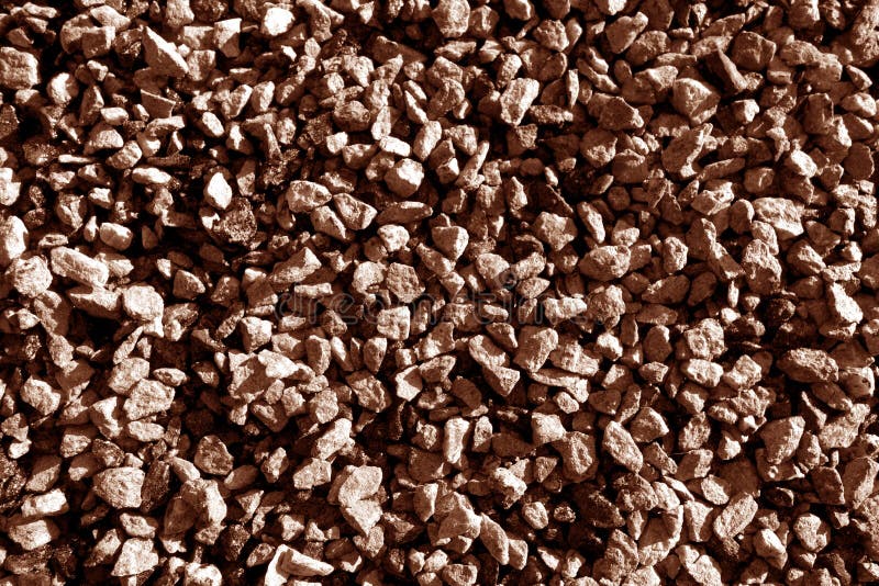 Stone couleur marron de modèle de gros plan de gravier. Modèle de pierre de gros plan de gravier. Fond et texture pour le design