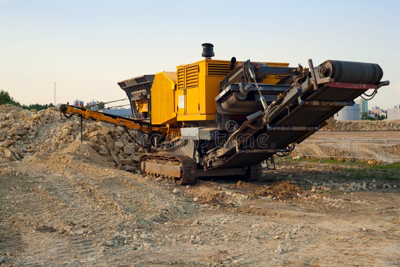 Mobile Stone Crusher Machine By The Construction Site Or Mining Quarry For  Crushing Old Concrete Slabs Into Gravel And Subsequent Cement Production.  Stock Photo, Picture and Royalty Free Image. Image 130474849.