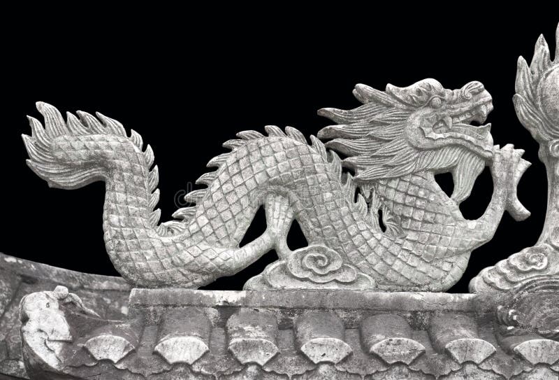 The stone dragon on black isolated background