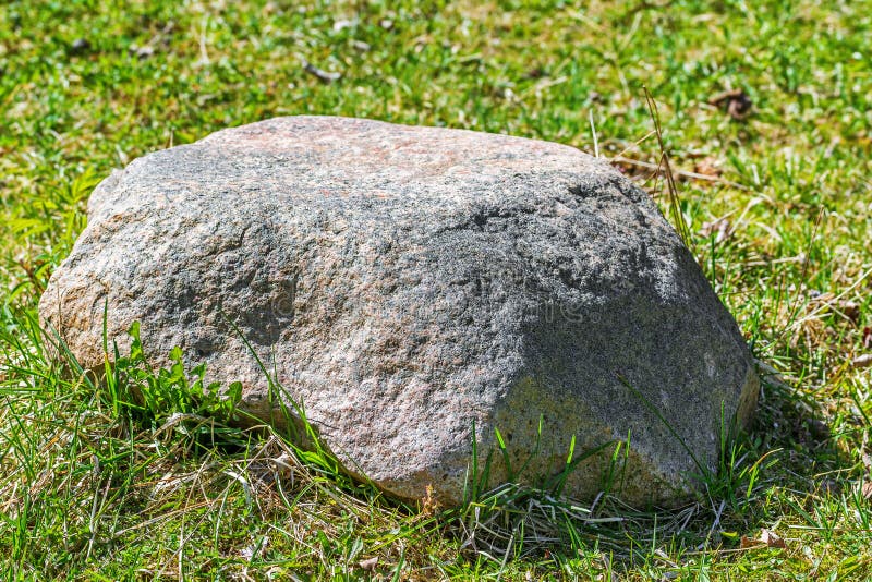 Stone in the grass