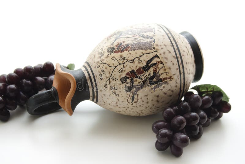 Stone jug with wine grapes