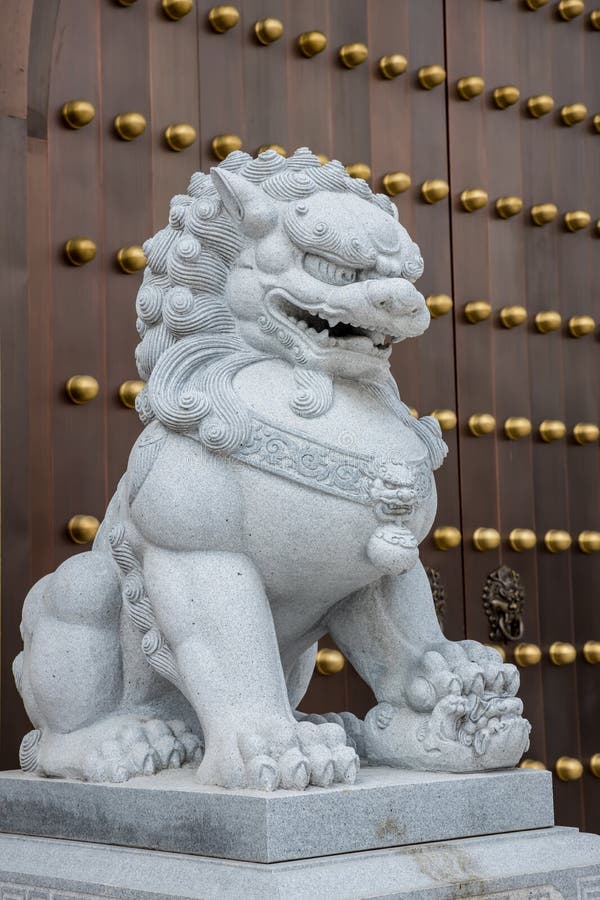 Stone Lion Statue in Front Gate of Temple. Stone Lion in China Stock