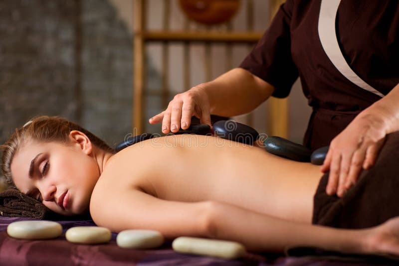 Stone massage back spa for a woman.