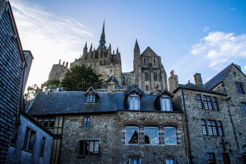 Stone medieval houses and a cathedral in the city of Seint Michel Abbey stock photos Stone medieval houses and a cathedral in the city of Seint Michel Abbey stock photos