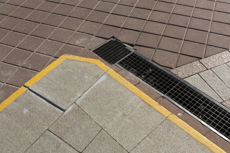 Street Drainage Sewer System With Metal Grid Cover . Stock Image ...