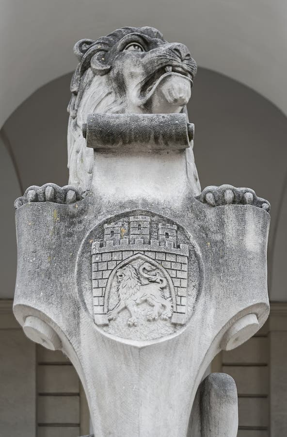 Stone sculpture of sitting lion at the entrance of Town Hall, Ukraine royalty free stock photos Stone sculpture of sitting lion at the entrance of Town Hall, Ukraine royalty free stock photos