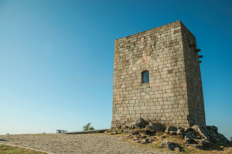 Stone square tower over rocky hill at Guarda