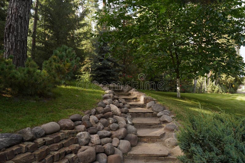 stone-steps-lined-with-cobblestones-in-a-picturesque-garden-with