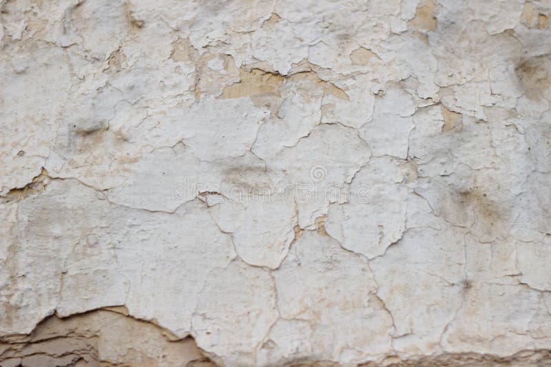 Stone Wall with a Multilayered Old Tumbling Whitewash Texture Stock
