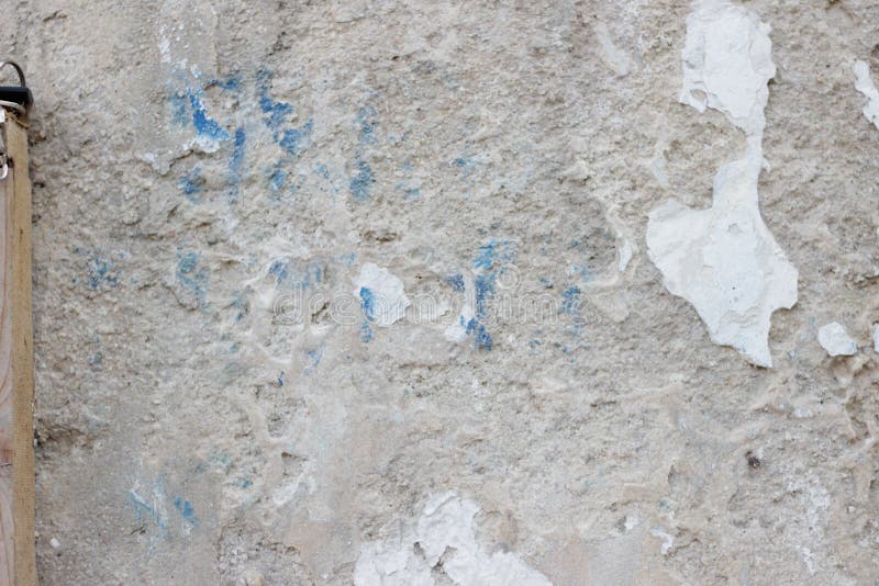 Stone Wall with a Multilayered Old Tumbling Whitewash Texture Stock