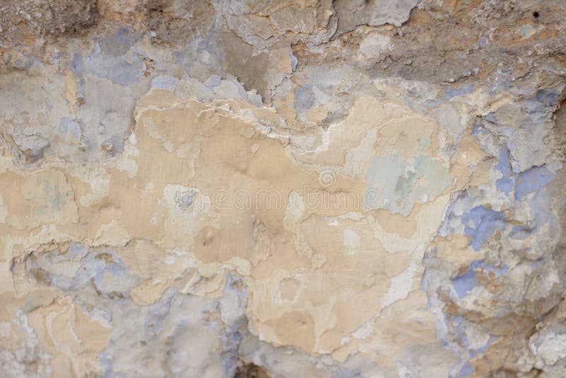 Stone Wall with a Multilayered Old Tumbling Whitewash Texture Stock
